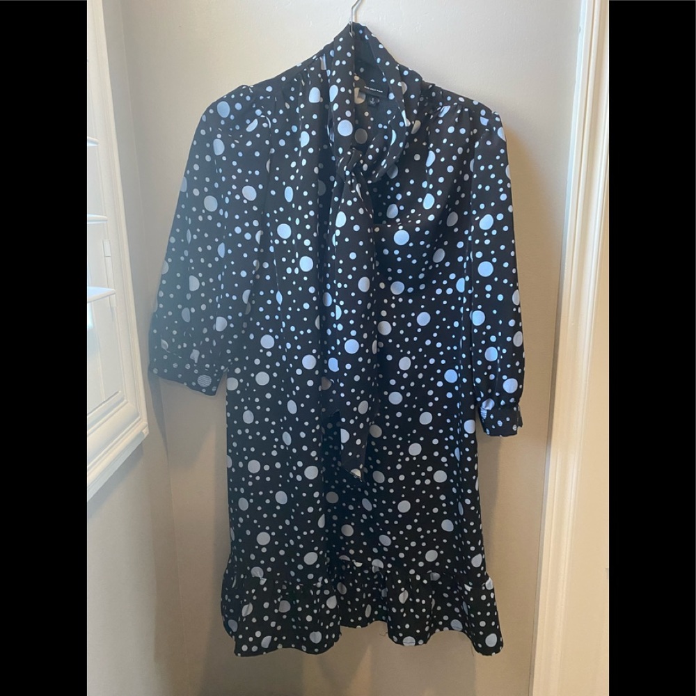 Blue long sleeved dress .